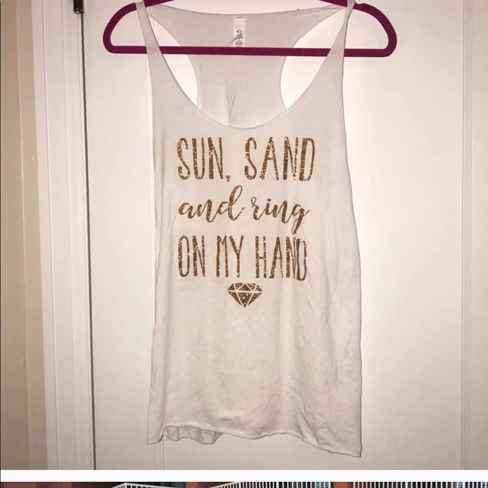 Sun sand and a ring on my hand tank